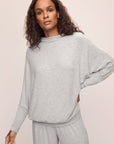 Model wears Cozy Time Mock Neck Pullover in Lt. Heather Grey.