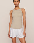 Model is wearing Essential Rib Tank in Beige