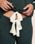 Model is wearing Gisele TENCEL™ Modal Slouchy PJ Set  in Pine/Ivory