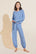 Model is wearing the Gisele TENCEL™ Modal Slouchy PJ Set in Vista Blue.