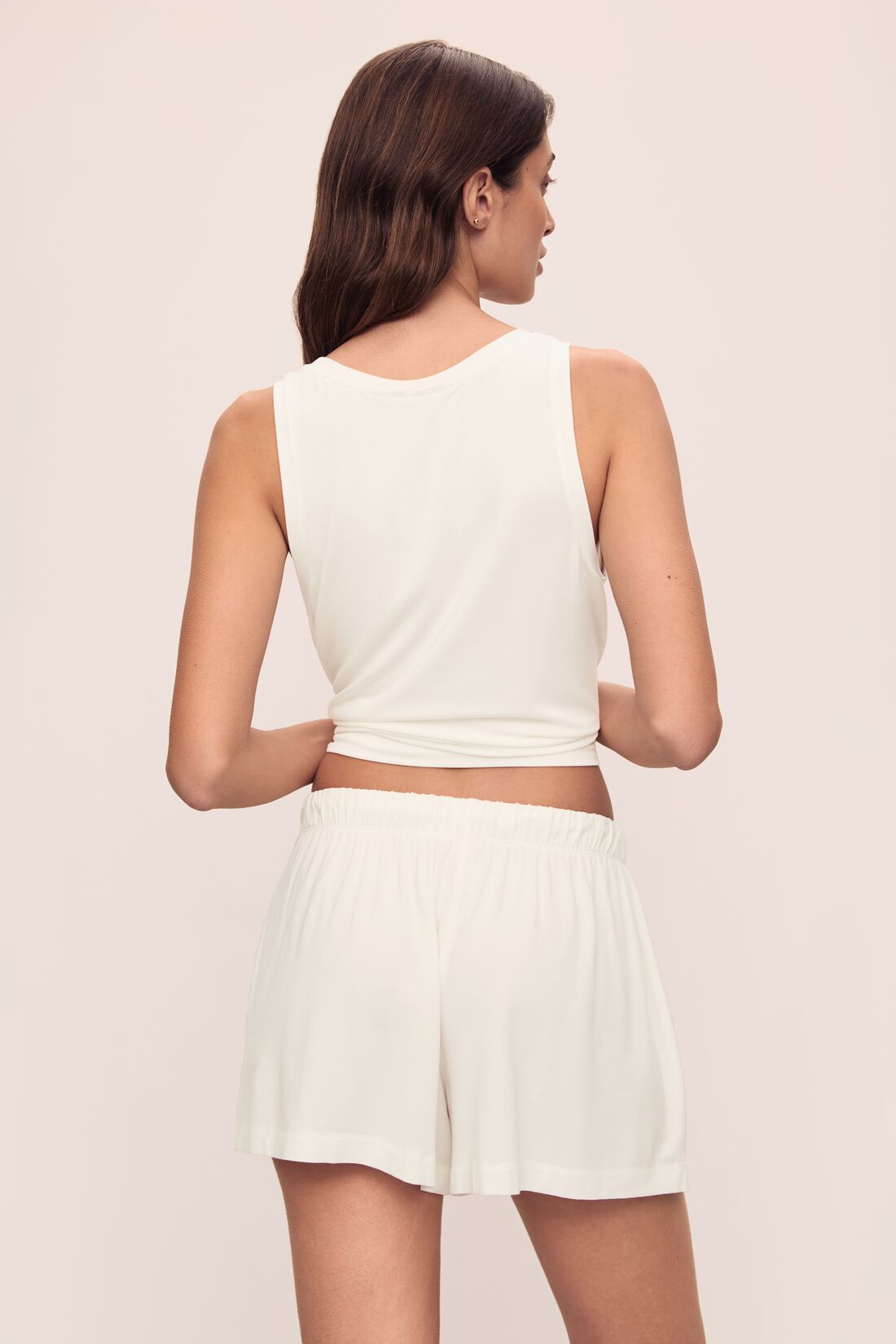 Model wears Gisele TENCEL™ Modal Everyday Relaxed Short in Ivory.