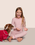 Model is wearing Kids Printed TENCEL™ Modal Unisex Long PJ Set  in Duo Stripe Hollyred/Hollyred