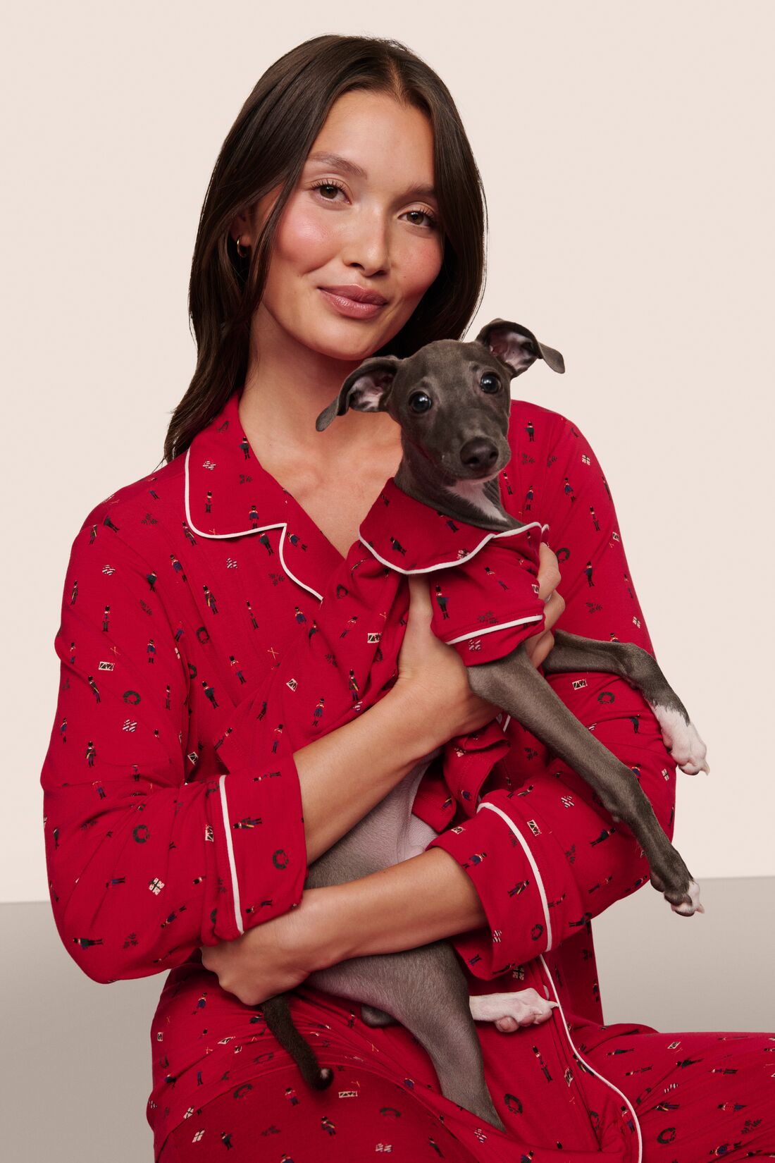 Model is wearing Gisele Printed TENCEL™ Modal Long PJ Set in Nutcracker Holly Red/Ivory