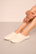 Model is wearing sherpa slipper in ivory