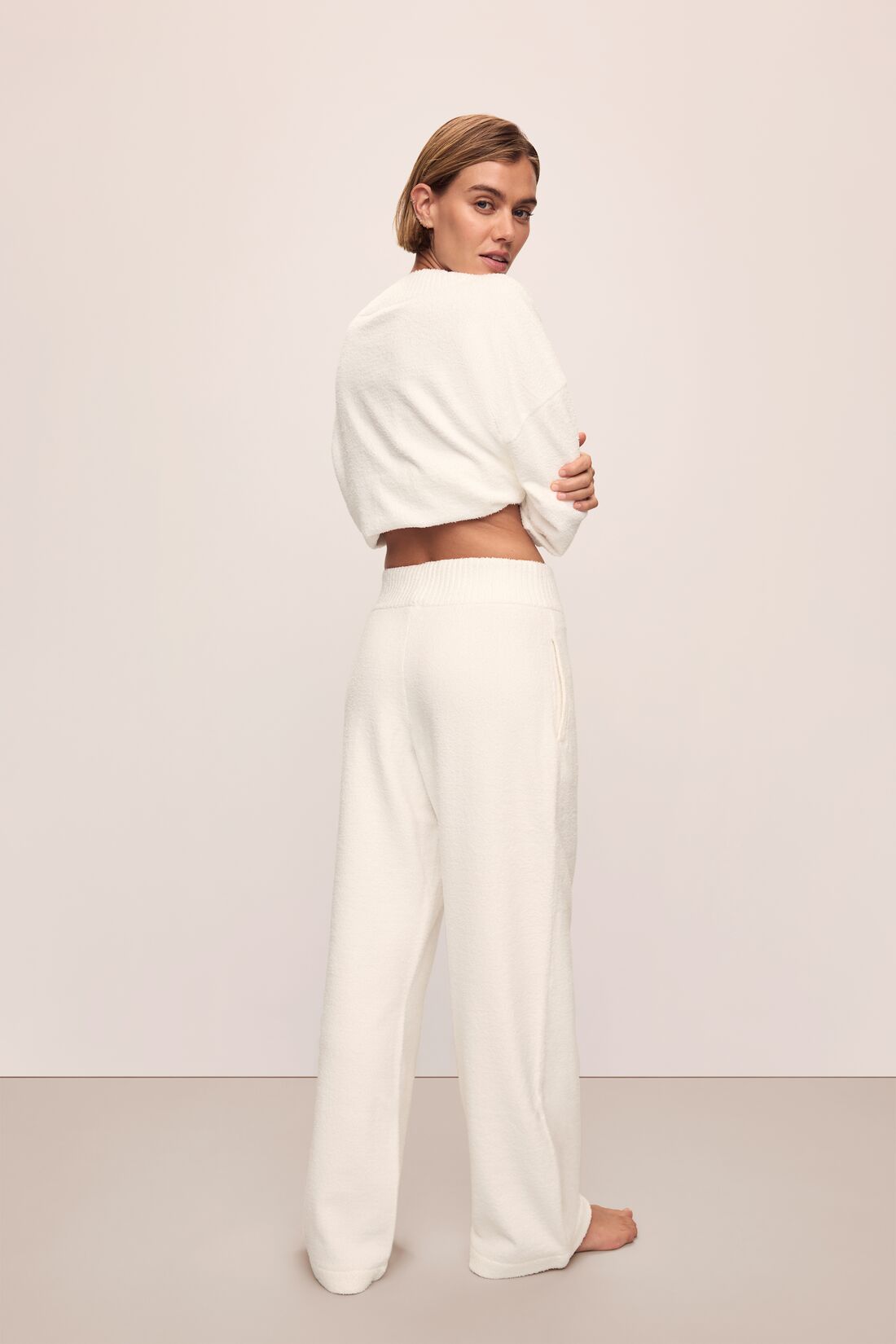 Model in Recycled Boucle Oversized V-neck Sweater and Relaxed Fit Pant in Ivory