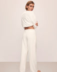 Model in Recycled Boucle Oversized V-neck Sweater and Relaxed Fit Pant in Ivory