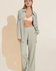 Model wears Luxe Sweats Wide Leg Pant in Botanical Zen Green.