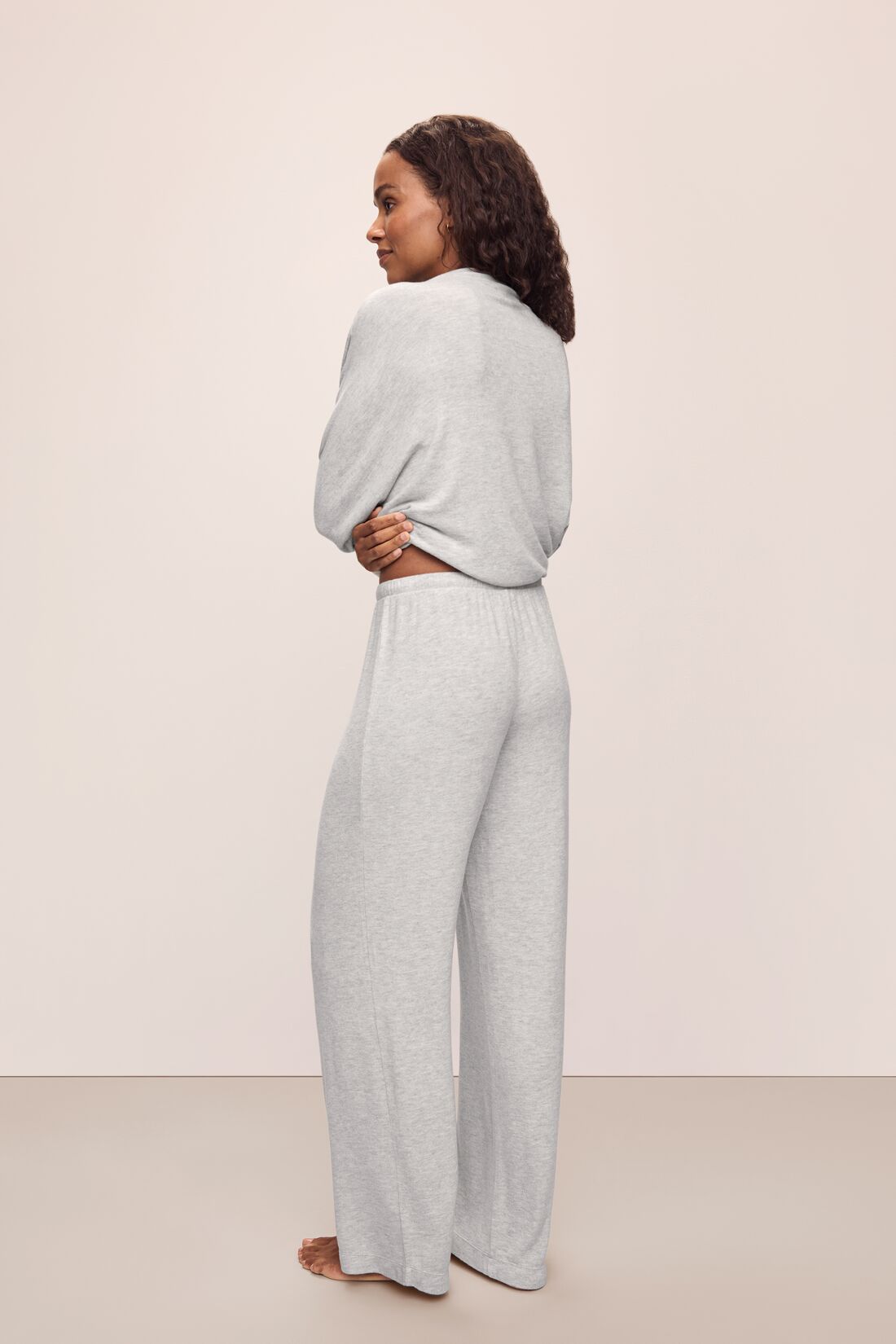 Model wears Cozy Time Wide Leg Pant in Lt. Heather Grey.