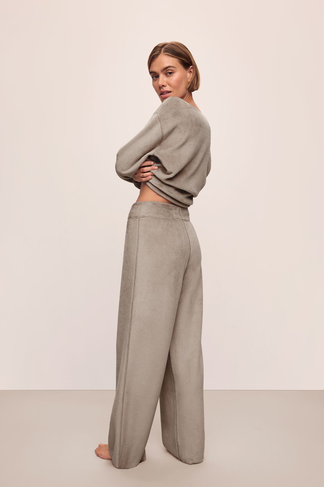 Model wears Reversible Plush High Waist Pant in Toffee.