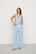 Model is wearing Linen Blend Relaxed Pant in Gingham White/Summer Blue
