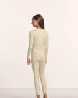 Model is wearing Kids TENCEL™ Modal Unisex Long PJ Set in Buttercream/Ivory