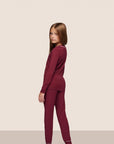 Model is wearing Kids TENCEL™ Modal Unisex Long PJ Set  in Bordeaux/Ivory