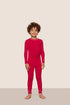 Model is wearing Kids TENCEL™ Modal Unisex Long PJ Set  in Holly Red/Ivory