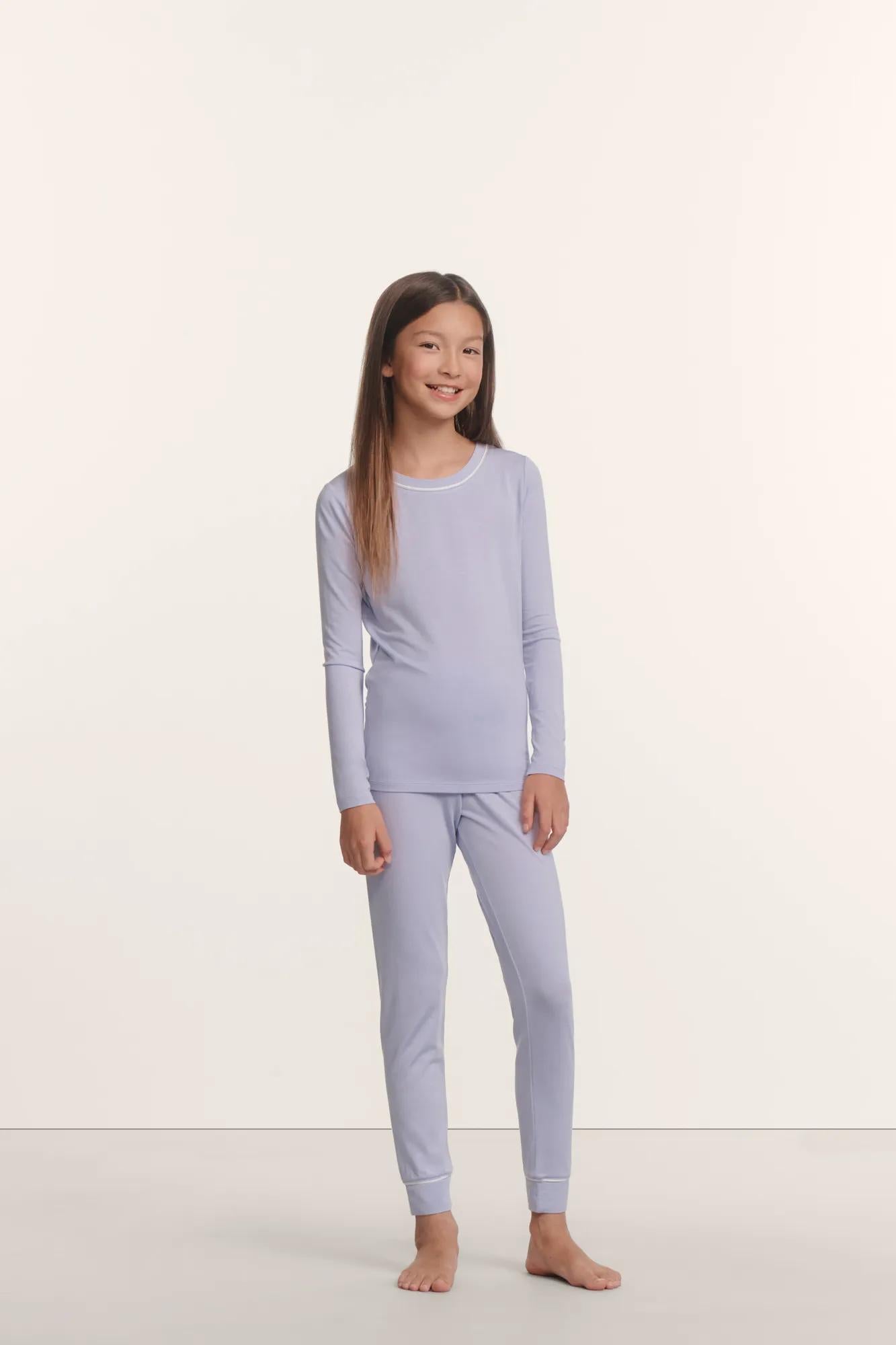 Model is wearing Kids TENCEL™ Modal Unisex Long PJ Set in Lavender Dusk/Ivory