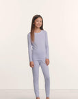 Model is wearing Kids TENCEL™ Modal Unisex Long PJ Set in Lavender Dusk/Ivory