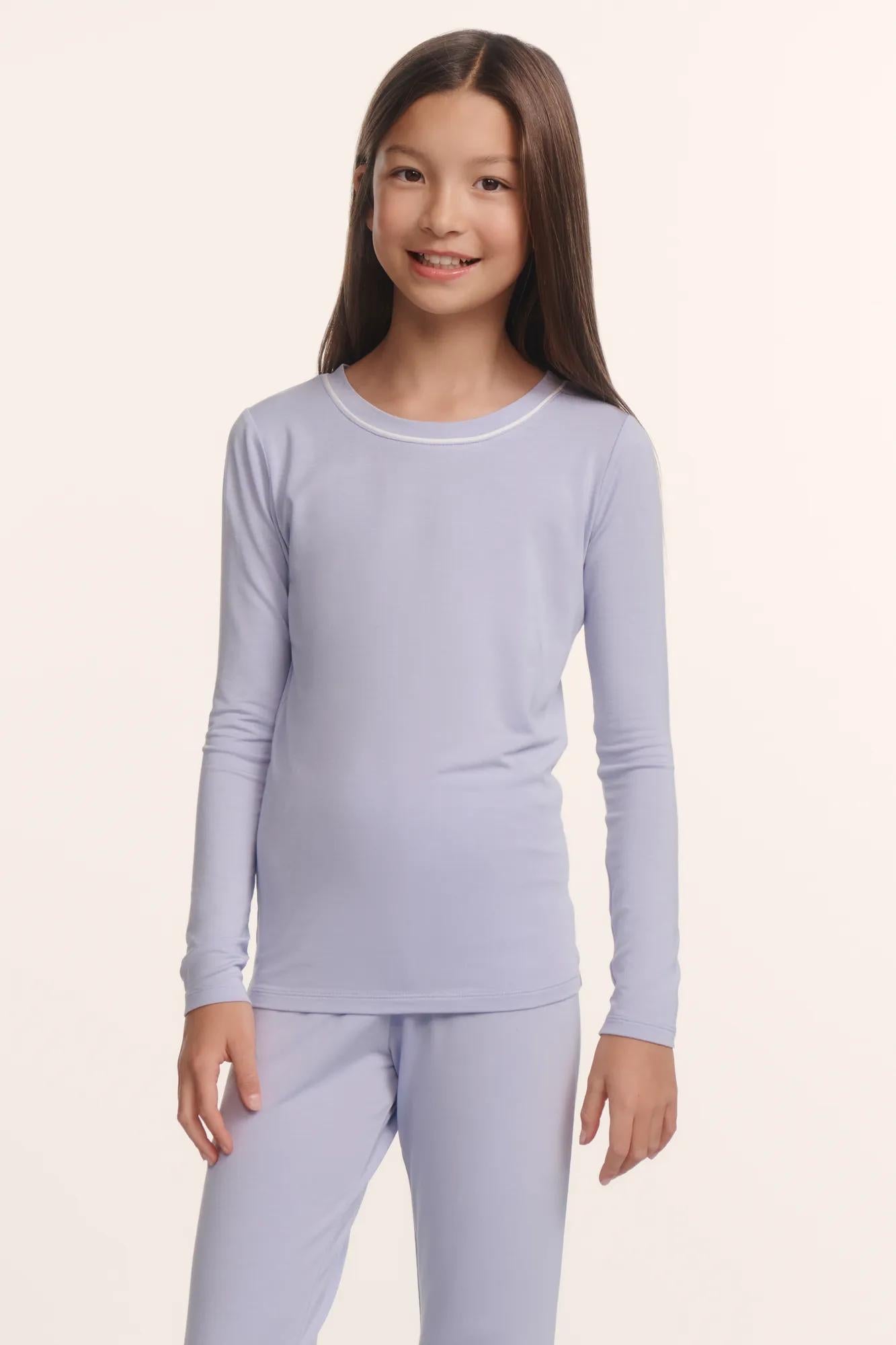 Model is wearing Kids TENCEL™ Modal Unisex Long PJ Set in Lavender Dusk/Ivory