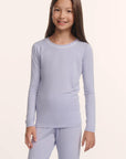 Model is wearing Kids TENCEL™ Modal Unisex Long PJ Set in Lavender Dusk/Ivory