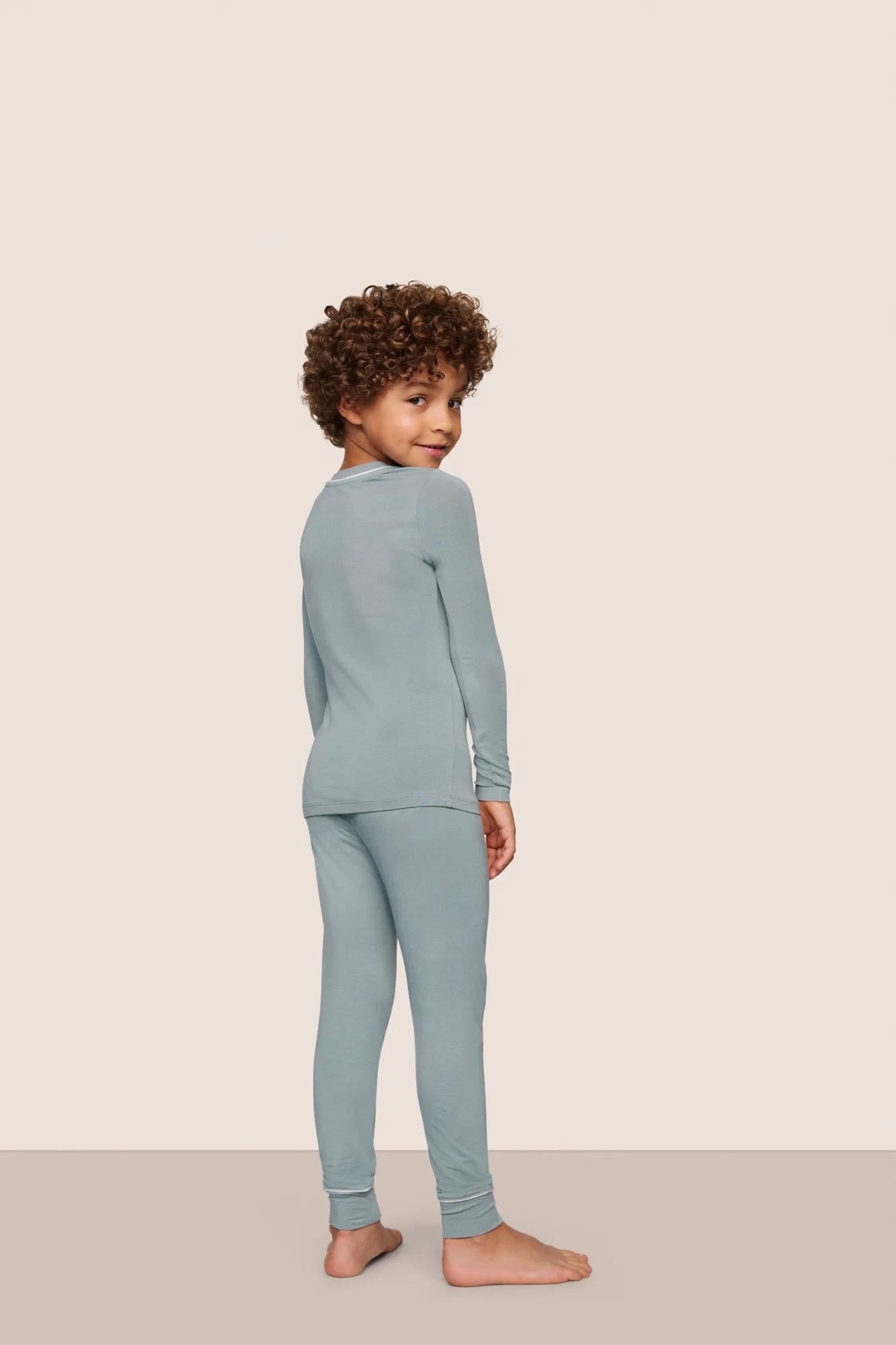 Model is wearing Kids TENCEL™ Modal Unisex Long PJ Set  in Lead/Ivory