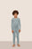 Model is wearing Kids TENCEL™ Modal Unisex Long PJ Set  in Lead/Ivory