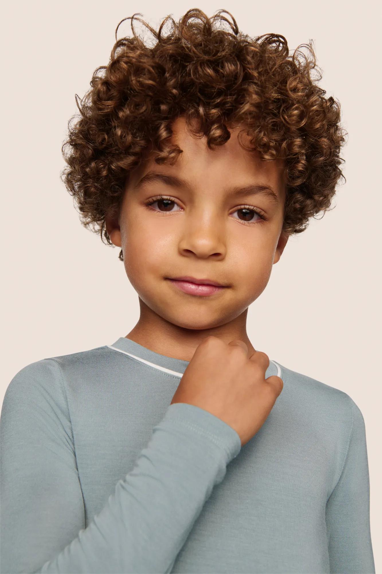 Model is wearing Kids TENCEL™ Modal Unisex Long PJ Set  in Lead/Ivory