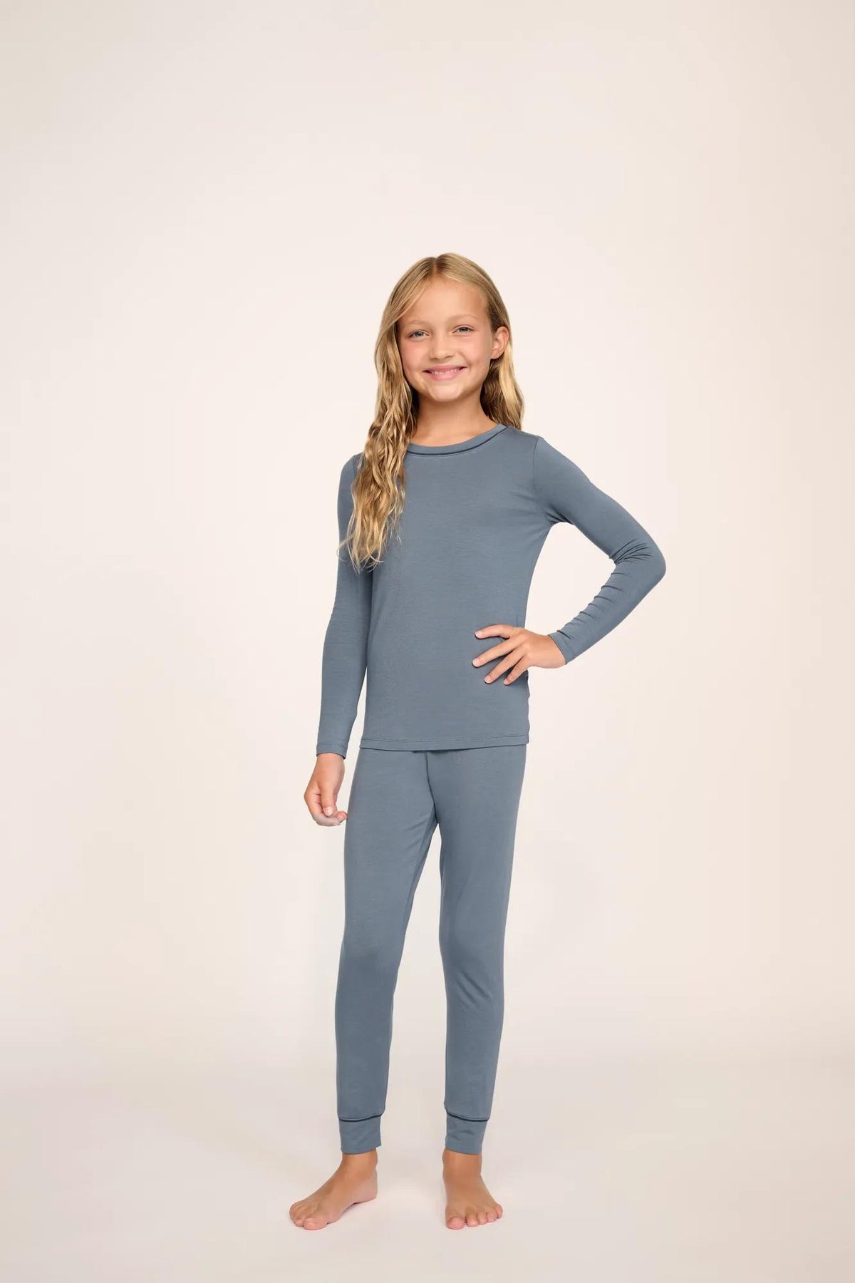 Model is wearing Kids TENCEL™ Modal Unisex Long PJ Set in Moonlight Blue/Navy