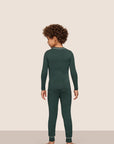 Model is wearing Kids TENCEL™ Modal Unisex Long PJ Set  in Pine/Ivory