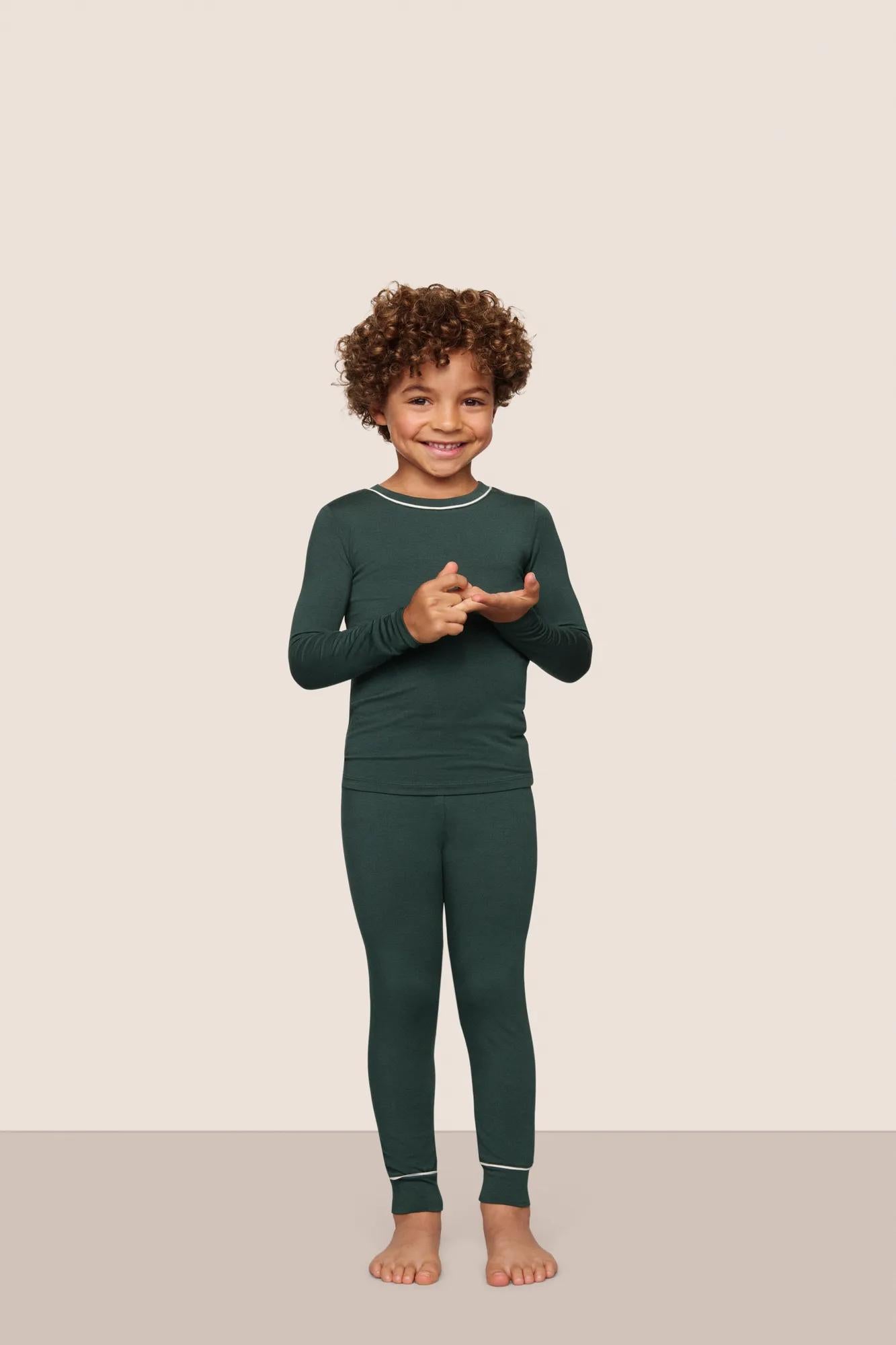 Model is wearing Kids TENCEL™ Modal Unisex Long PJ Set  in Pine/Ivory