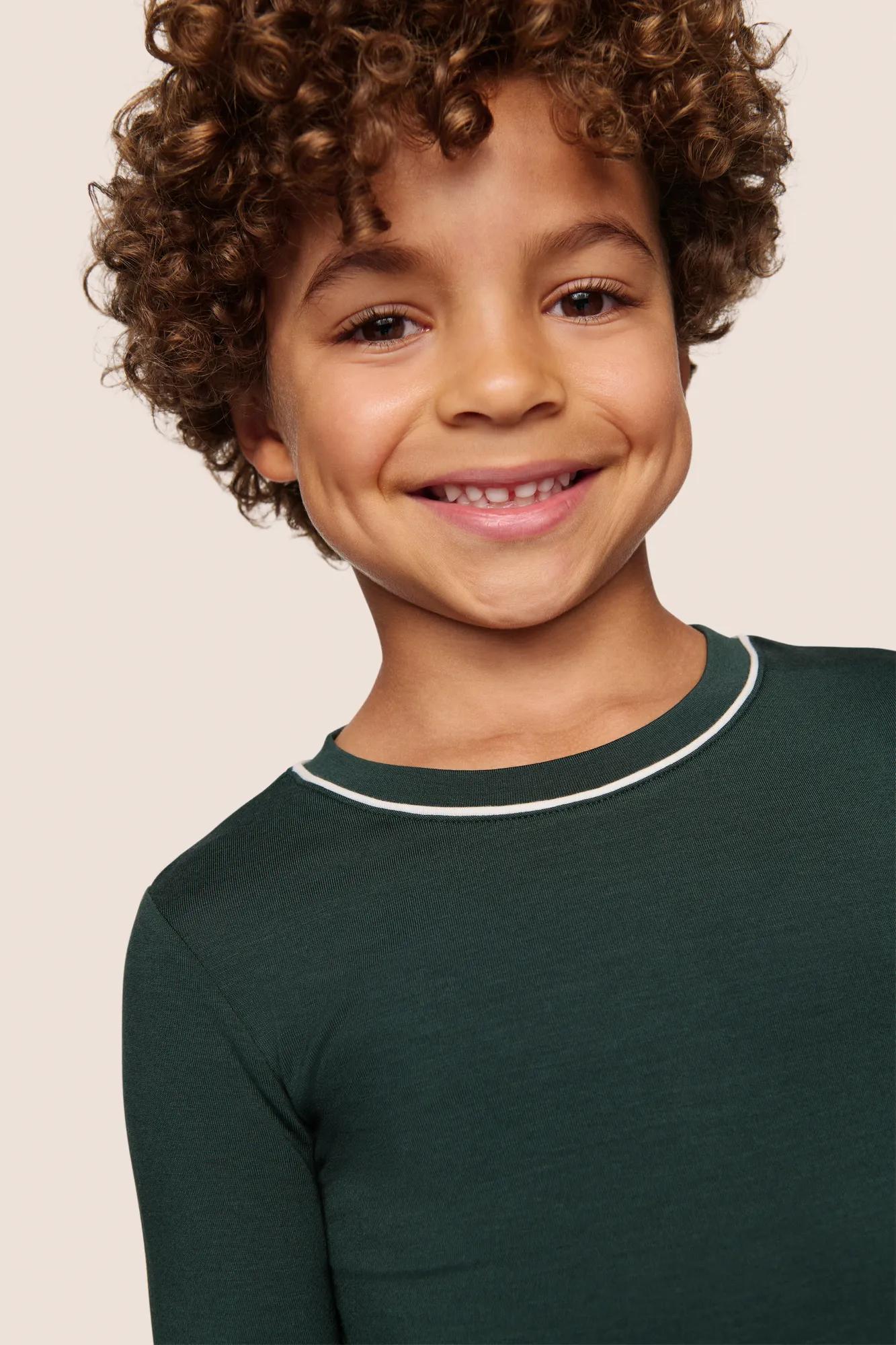 Model is wearing Kids TENCEL™ Modal Unisex Long PJ Set  in Pine/Ivory