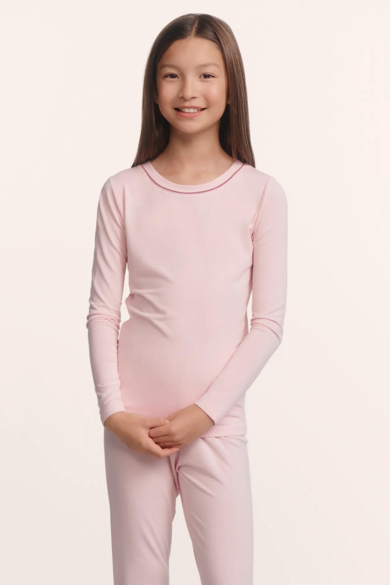 Model is wearing Kids TENCEL™ Modal Unisex Long PJ Set in Pale Pink/Fig