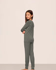 Model is wearing Kids TENCEL™ Modal Unisex Long PJ Set  in Smokey Olive/Ivory