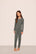 Model is wearing Kids TENCEL™ Modal Unisex Long PJ Set  in Smokey Olive/Ivory