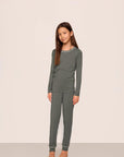 Model is wearing Kids TENCEL™ Modal Unisex Long PJ Set  in Smokey Olive/Ivory
