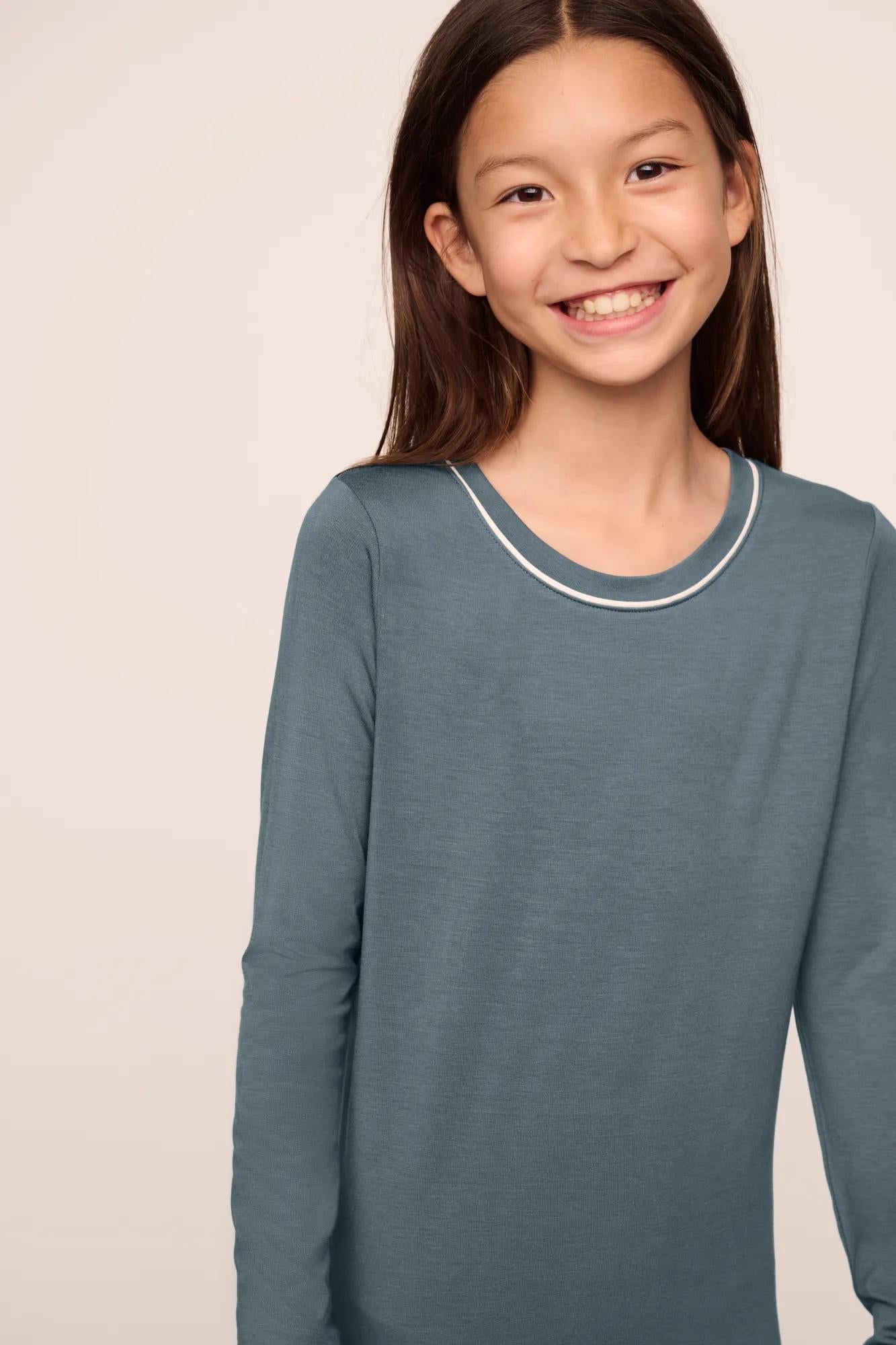 Model is wearing Kids TENCEL™ Modal Unisex Long PJ Set  in  Stone Blue/Ivory