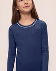 Model is wearing Kids TENCEL™ Modal Unisex Long PJ Set in Navy/Ivory