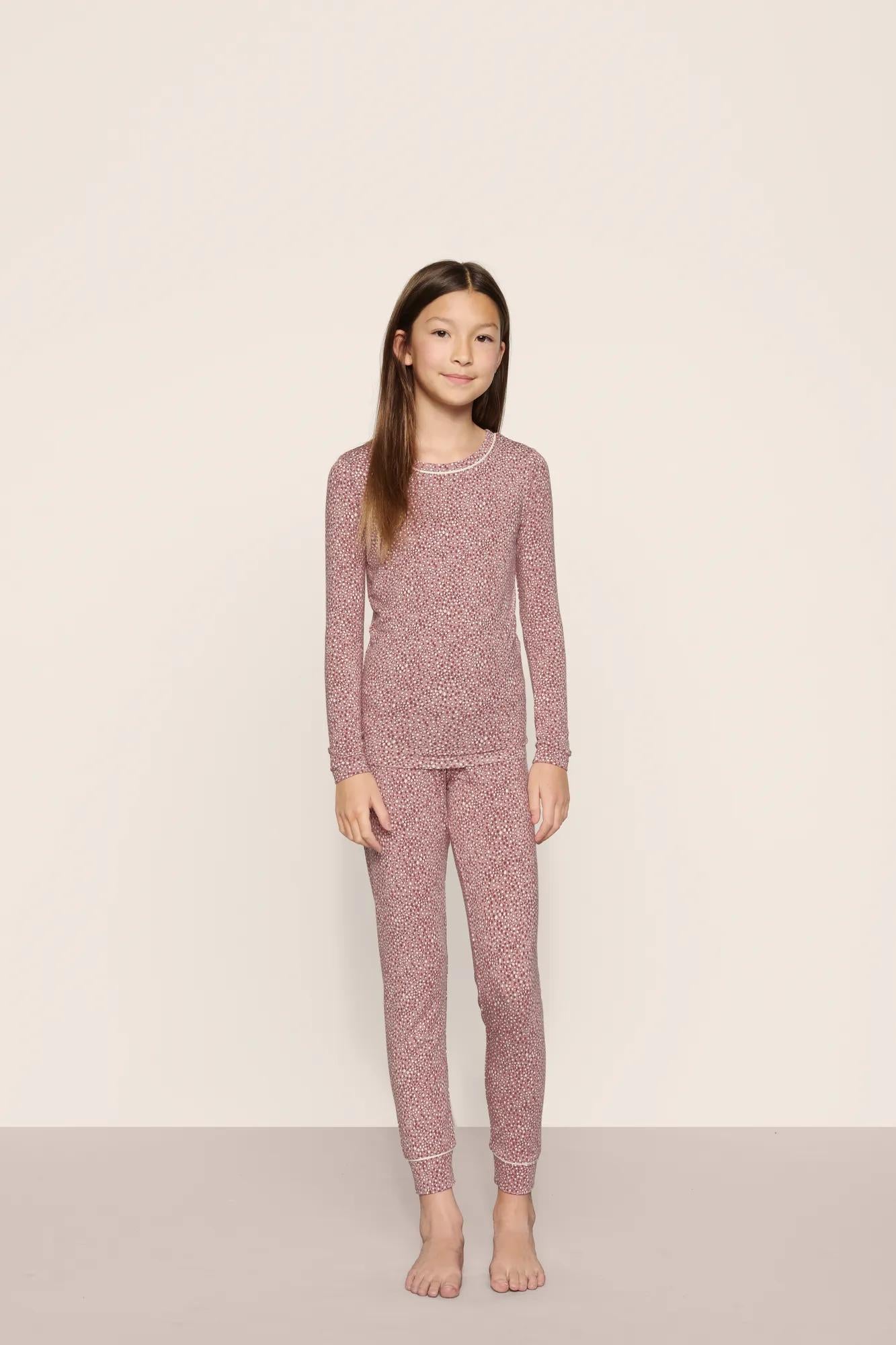 Model is wearing Kids Printed TENCEL™ Modal Unisex Long PJ Set in Animal Instinct Woodrose/Ivory