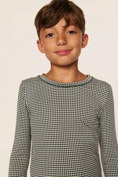 Model is wearing Kids Printed TENCEL™ Modal Unisex Long PJ Set in Cabin Check Ivory/Pine