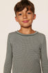 Model is wearing Kids Printed TENCEL™ Modal Unisex Long PJ Set in Cabin Check Ivory/Pine