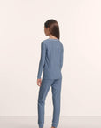 Model is wearing Kids Printed TENCEL™ Modal Unisex Long PJ Set in Duo Stripe Slate Blue/Ivory