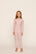 Model is wearing Kids Printed TENCEL™ Modal Unisex Long PJ Set in Duo Stripe Hollyred/Hollyred