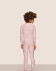 Model is wearing Kids Printed TENCEL™ Modal Unisex Long PJ Set  in Duo Stripe Hollyred/Hollyred