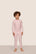 Model is wearing Kids Printed TENCEL™ Modal Unisex Long PJ Set  in Duo Stripe Hollyred/Hollyred