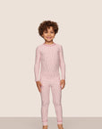 Model is wearing Kids Printed TENCEL™ Modal Unisex Long PJ Set  in Duo Stripe Hollyred/Hollyred