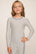 Model is wearing Kids Printed TENCEL™ Modal Unisex Long PJ Set in Duo Stripe Ivory/Navy