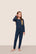 Model is wearing Kids Printed TENCEL™ Modal Unisex Long PJ Set  in Forest Pine Navy/Ivory
