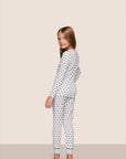 Model is wearing Kids Printed TENCEL™ Modal Unisex Long PJ Set  in Hannukah Glow Nouvean Navy/Ny