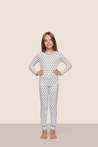 Model is wearing Kids Printed TENCEL™ Modal Unisex Long PJ Set in Hannukah Glow Nouvean Navy/Ny