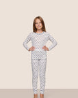Model is wearing Kids Printed TENCEL™ Modal Unisex Long PJ Set  in Hannukah Glow Nouvean Navy/Ny