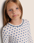 Model is wearing Kids Printed TENCEL™ Modal Unisex Long PJ Set  in Hannukah Glow Nouvean Navy/Ny