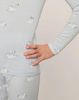 Model is wearing Kids Printed TENCEL™ Modal Unisex Long PJ Set in Large Swans Ice Blue/Ivory