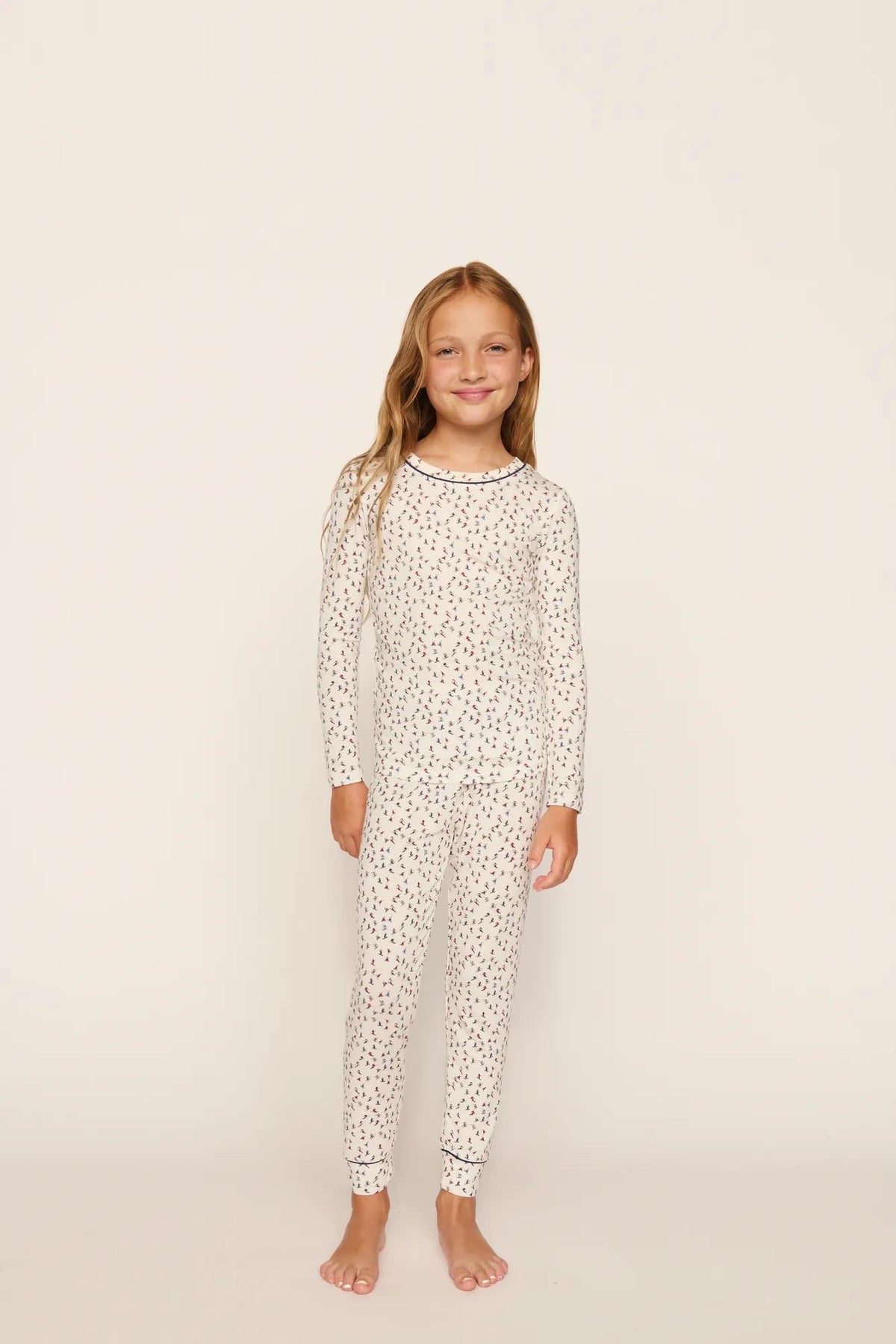 Model is wearing Kids Printed TENCEL™ Modal Unisex Long PJ Set in On The Slopes Ivory/Navy